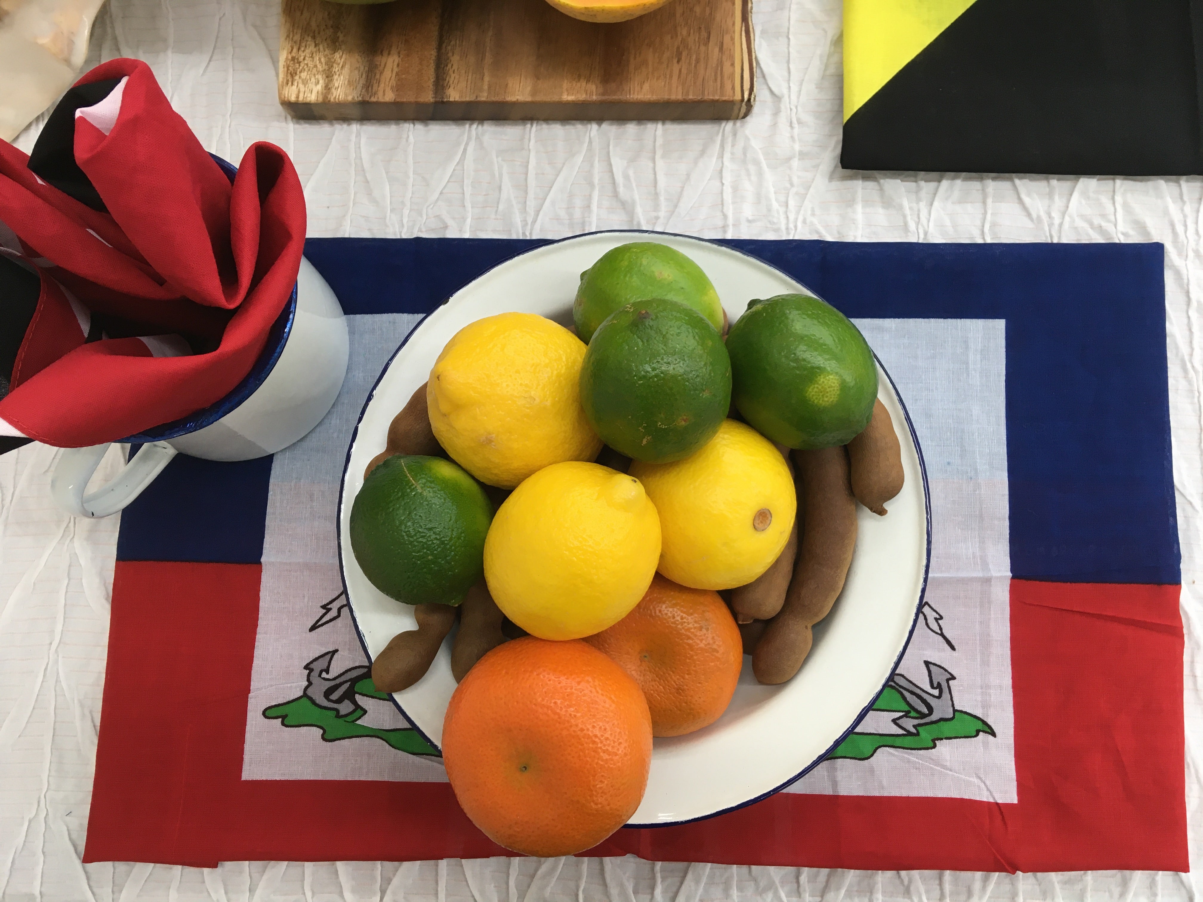 Dine with style! Set the table for a Caribbean meal with handcrafted wooden home goods from Haiti and enamelware essentials.